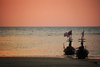 Scenic view of sea against clear sky during sunset