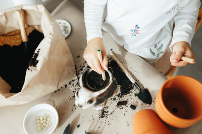 High angle view of woman preparing food on table