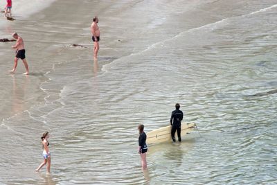 People standing on beach