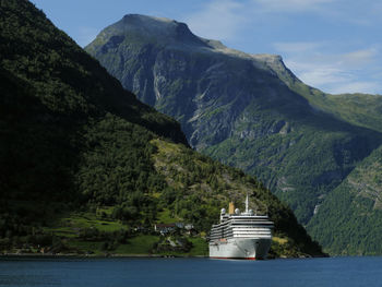 Scenic view of mountains and sea against sky