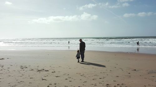 Full length of man on beach against sky