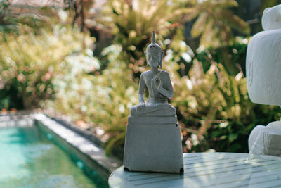 Close-up of statue against trees