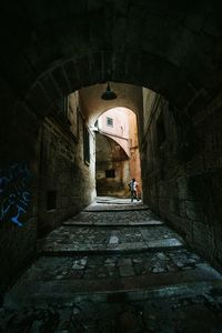 Man standing in tunnel