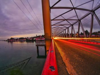 Scenic view of bridge against sky at sunset
