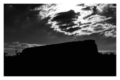 Low angle view of building against cloudy sky