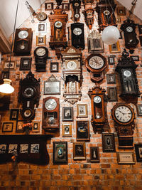 Low angle view of clock hanging at market stall