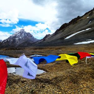 Scenic view of mountains against cloudy sky