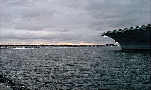 Scenic view of sea against cloudy sky