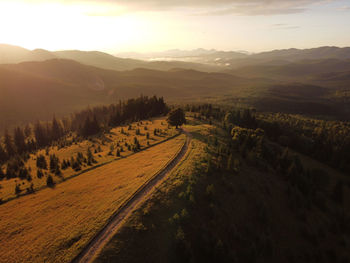 Scenic view of landscape against sky during sunset