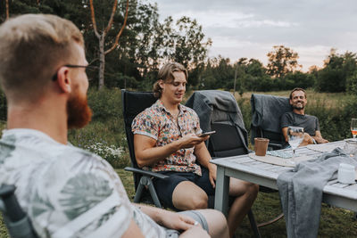 Friends sitting on table