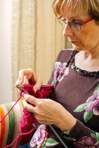 Midsection of woman looking at camera