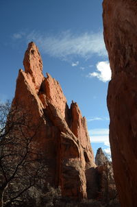 Low angle view of rock formation against sky