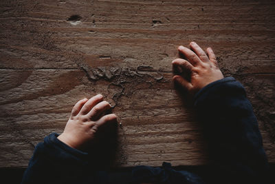 Low section of person on wooden floor