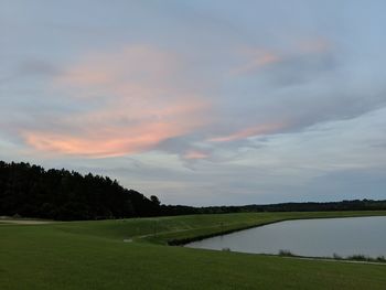 Scenic view of field against sky during sunset