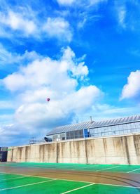 Low angle view of building against cloudy sky