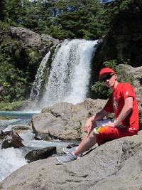 Scenic view of waterfall against rocks