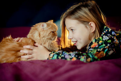 Young woman with cute kitten 