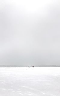 Scenic view of snow covered sea against sky