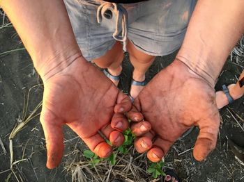 Close-up of man holding hands
