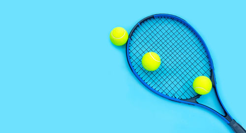 High angle view of yellow ball on blue background