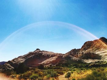 Low angle view of mountain against clear blue sky