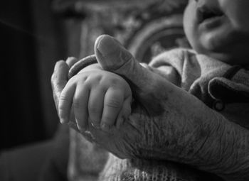 Close-up of baby holding hands