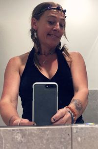 Mid adult woman using mobile phone