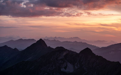 Scenic view of mountains against sky during sunset