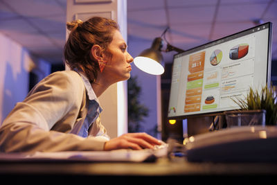 Young woman using laptop on table