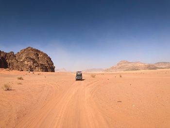 Scenic view of desert against clear sky