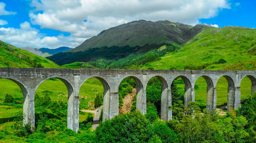 Arch bridge against sky