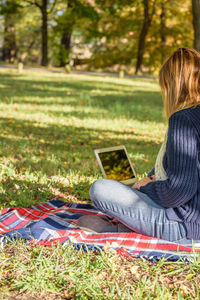 Woman relaxing on grass