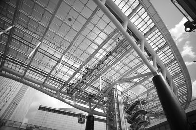 Low angle view of railroad station against sky