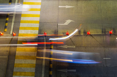 High angle view of light trails on road in city at night