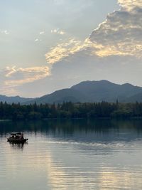 Scenic view of lake against sky during sunset