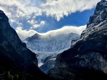 Scenic view of snowcapped mountains against sky