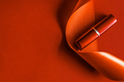 High angle view of usb cable on red background