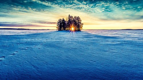 Scenic view of landscape against sky during sunset