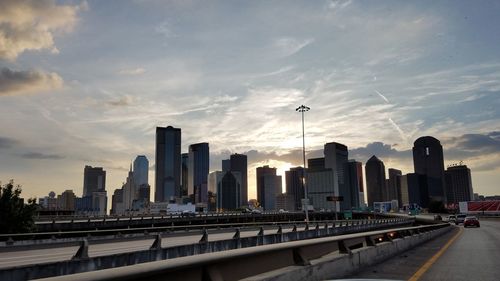 Skyscrapers against cloudy sky