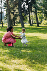 Mother and daughter on field