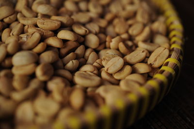 High angle view of arabica coffee beans in container