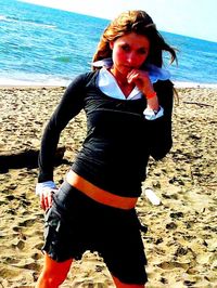 High angle view of woman standing on beach