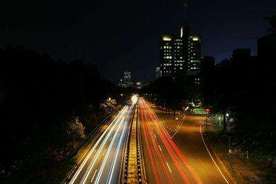 High angle view of light trails on city road at night