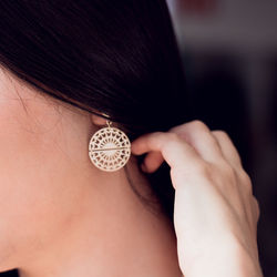 Midsection of woman wearing earring