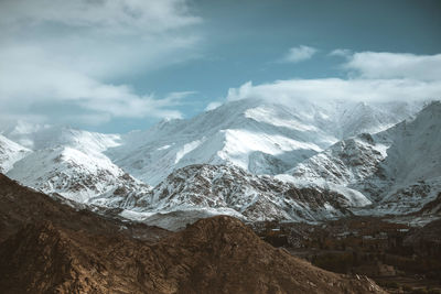 Scenic view of snowcapped mountains against sky