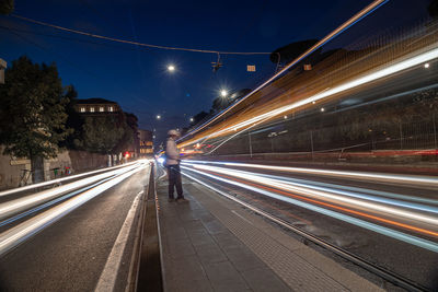 Blurred motion of light trails on road at night