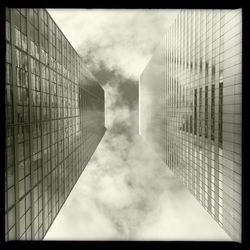 Low angle view of building against cloudy sky