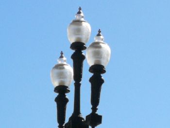 Low angle view of street light against clear sky