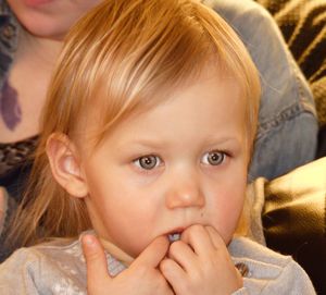 Close-up portrait of cute girl looking away