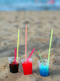 Glasses with frozen syrup on the beach